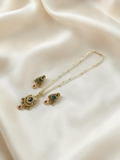 HERITAGE TEMPLE PEARL CHAIN PENDANT SET WITH GREEN CENTER & PINK DROP
